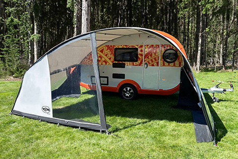 Isabella Tab_Sun at camping spot with grass and trees in background